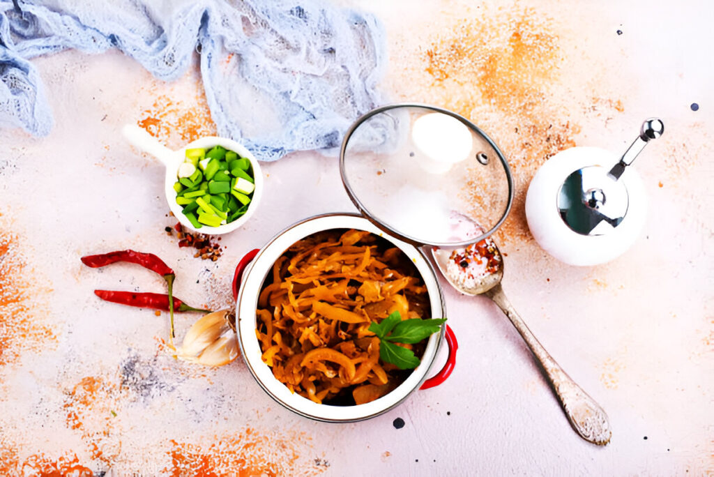 A delicious plate of spaghetti topped with marinara sauce, garnished with fresh basil and grated Parmesan cheese, served on a rustic wooden table.